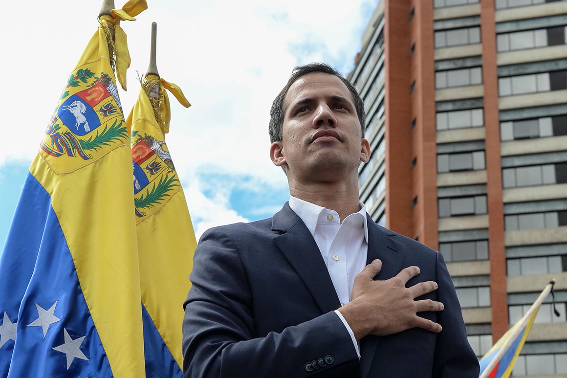 Venezuela's National Assembly head Juan Guaido declares himself the country's "acting president" during a mass opposition rally against leader Nicolas Maduro, on the anniversary of 1958 uprising that overthrew military dictatorship, in Caracas on January 23, 2019. - Moments earlier, the loyalist-dominated Supreme Court ordered a criminal investigation of the opposition-controlled legislature. "I swear to formally assume the national executive powers as acting president of Venezuela to end the usurpation, (install) a transitional government and hold free elections," said Guaido as thousands of supporters cheered. (Photo by Federico PARRA / AFP)        (Photo credit should read FEDERICO PARRA/AFP/Getty Images)
